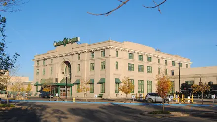 Casino Regina in the former Union Station: a pale stone building with an arched entrance and green awnings